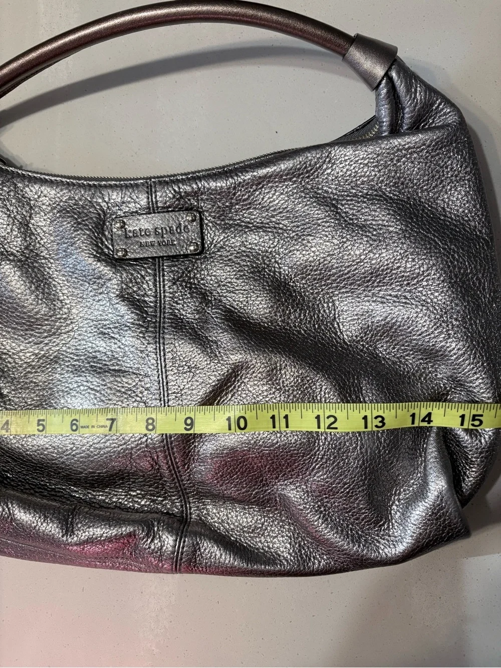 Kate Spade Janaya shiny silver hobo bag